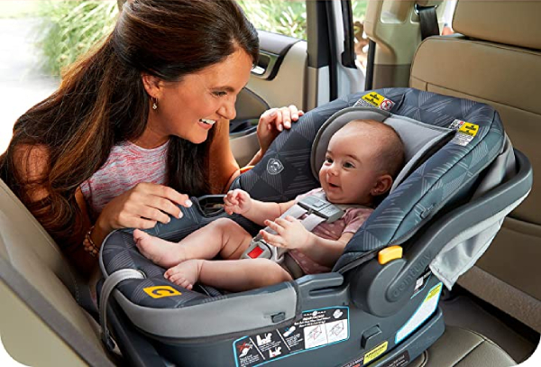 Mom looking at her baby using Century Carry On 35 LX Lightweight Infant Car Seat