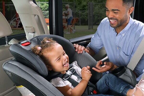 Dad setting up car seat in the middle